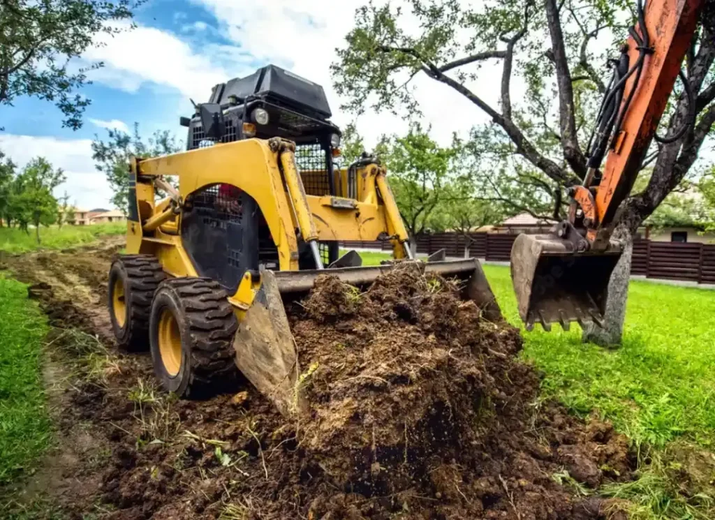 Skid steer excavating yard