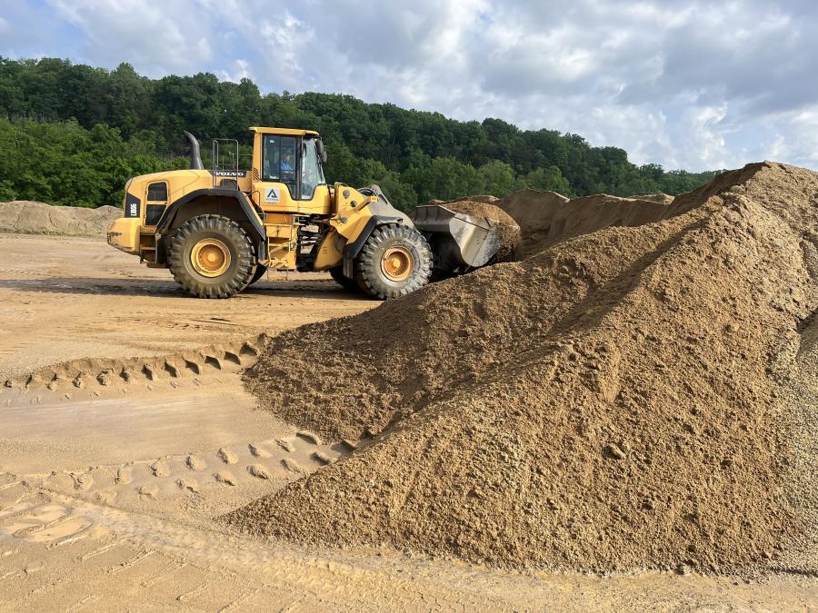 Wheel loader moving sand
